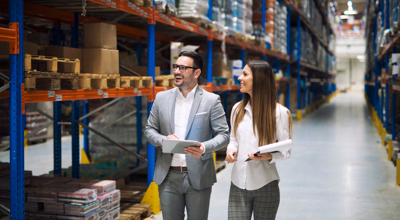 Man And Woman In Warehouse For Inventory Management