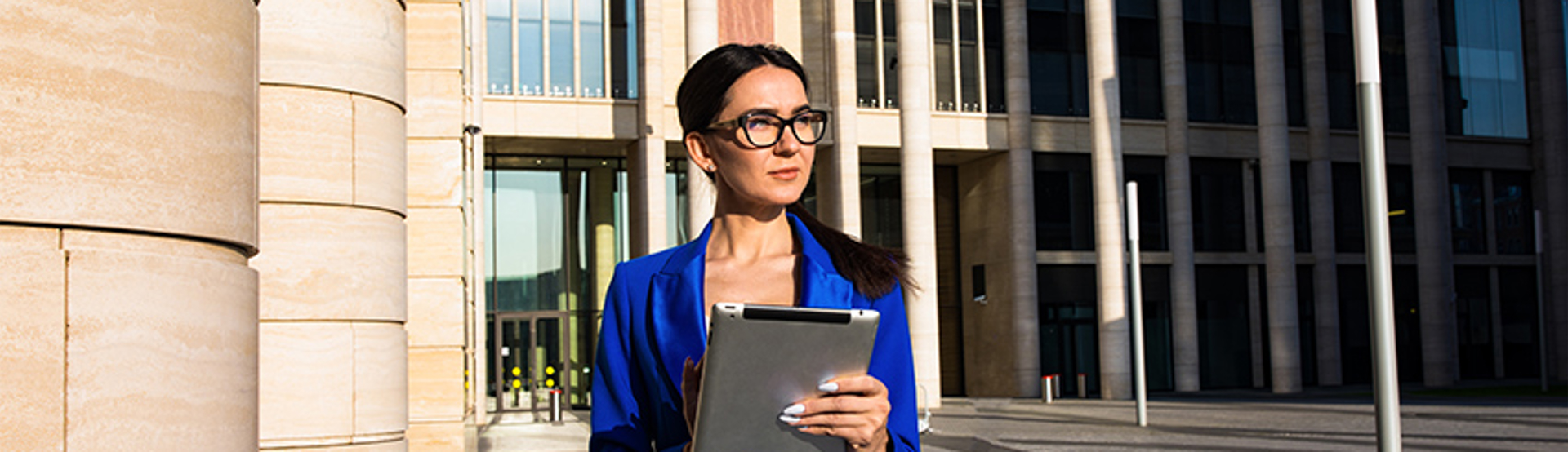 Woman Blue Suit Tablet Government Building GASB Financial Sustainability