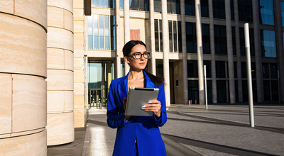 Woman Blue Suit Tablet Government Building GASB Financial Sustainability